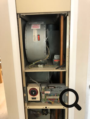 Johnson & Starley J25-32 with front panel removed, showing air circulation fan and time switch